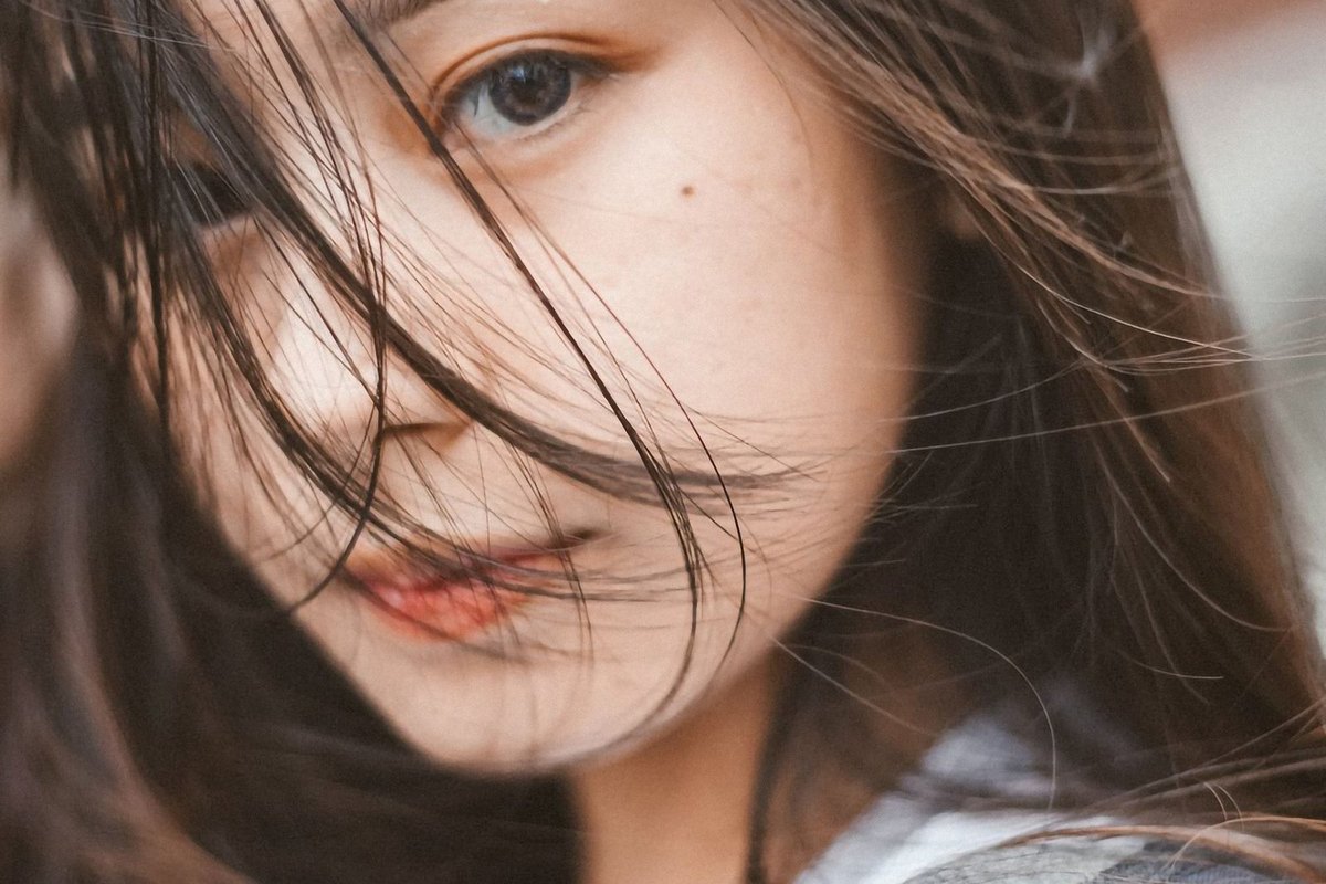 A woman with long straight dark hair